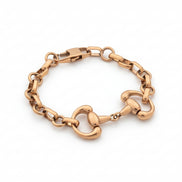 Gold chain bracelet on a white background