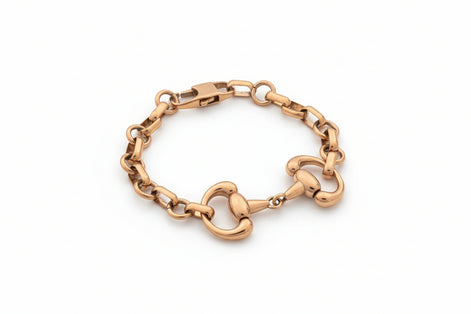 Gold chain bracelet on a white background