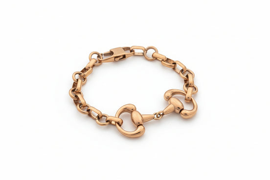 Gold chain bracelet on a white background