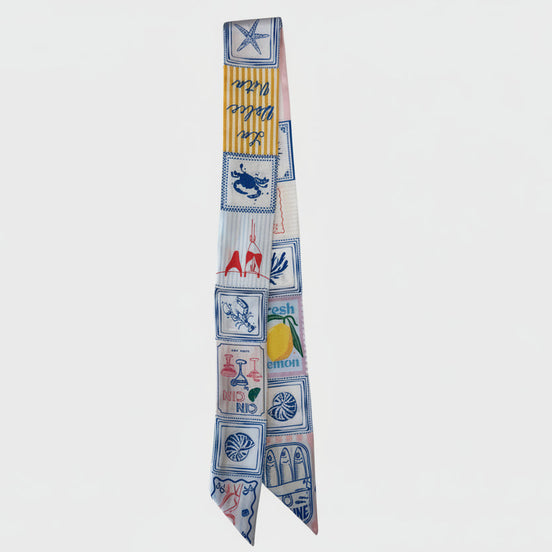 Decorative scarf with colorful patterns and text on a white background