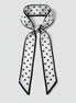 Black and white polka dot scarf on a white background