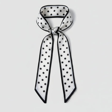Black and white polka dot scarf on a white background