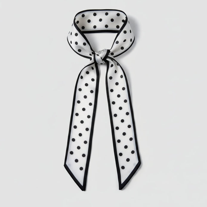 Black and white polka dot scarf on a white background