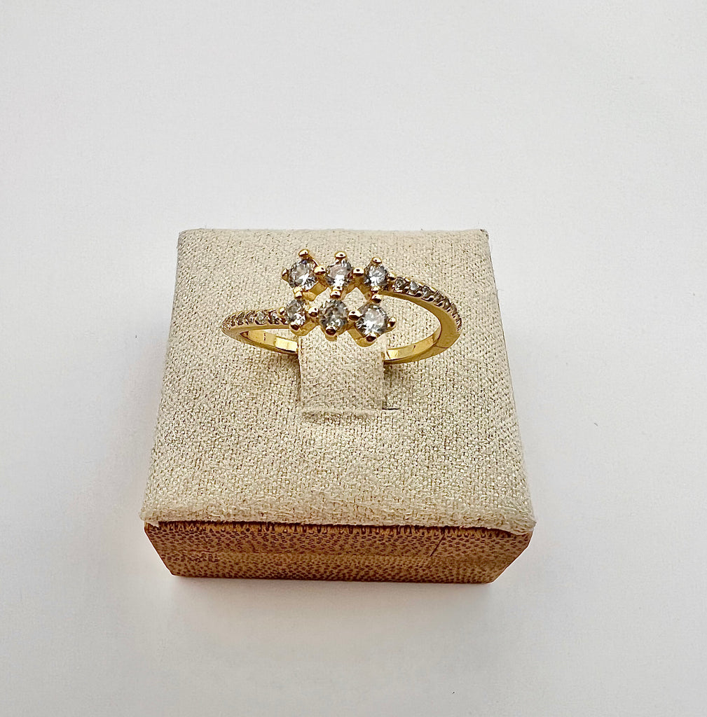14k gold dainty adjustable ring with cubic zirconia clusters on top and micro pave accents on the side