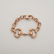 Gold chain bracelet on a white background