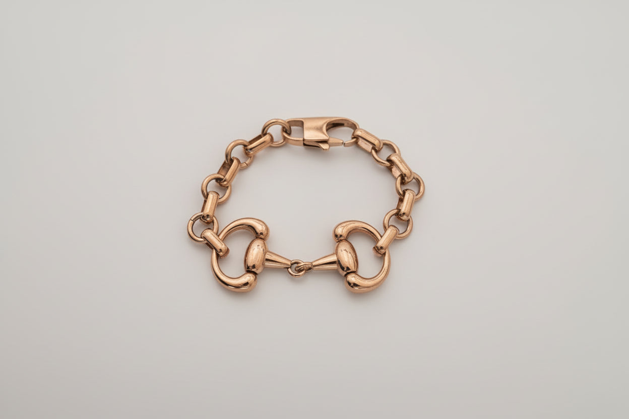 Gold chain bracelet on a white background