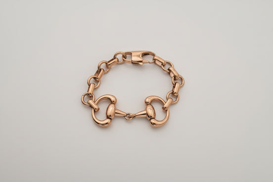 Gold chain bracelet on a white background