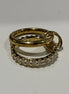Two gold rings with diamond accents on a white background
