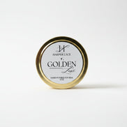 Gold container with 'Golden Lace' branding on a textured white background