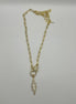 14K gold filled paperclip chain pendant necklace with a micro pave gold lobster clasp that holds a white enamel lightning bolt charm with micro pave accents