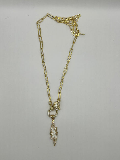 14K gold filled paperclip chain pendant necklace with a micro pave gold lobster clasp that holds a white enamel lightning bolt charm with micro pave accents