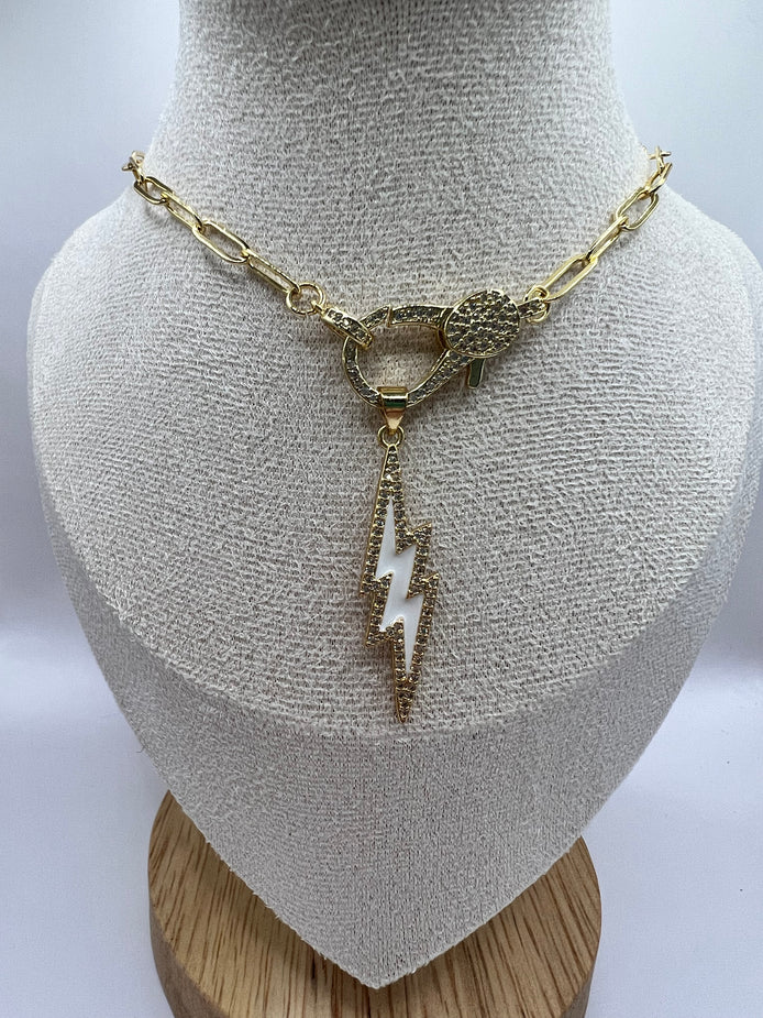 14K gold filled paperclip chain pendant necklace with a micro pave gold lobster clasp that holds a white enamel lightning bolt charm with micro pave accents