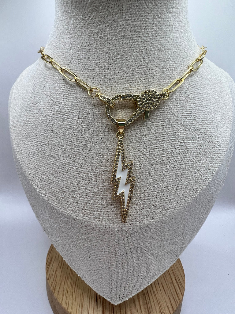 14K gold filled paperclip chain pendant necklace with a micro pave gold lobster clasp that holds a white enamel lightning bolt charm with micro pave accents