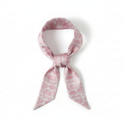 Long, narrow scarf with pink floral toile pattern on a white background