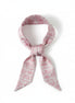 Long, narrow scarf with pink floral toile pattern on a white background