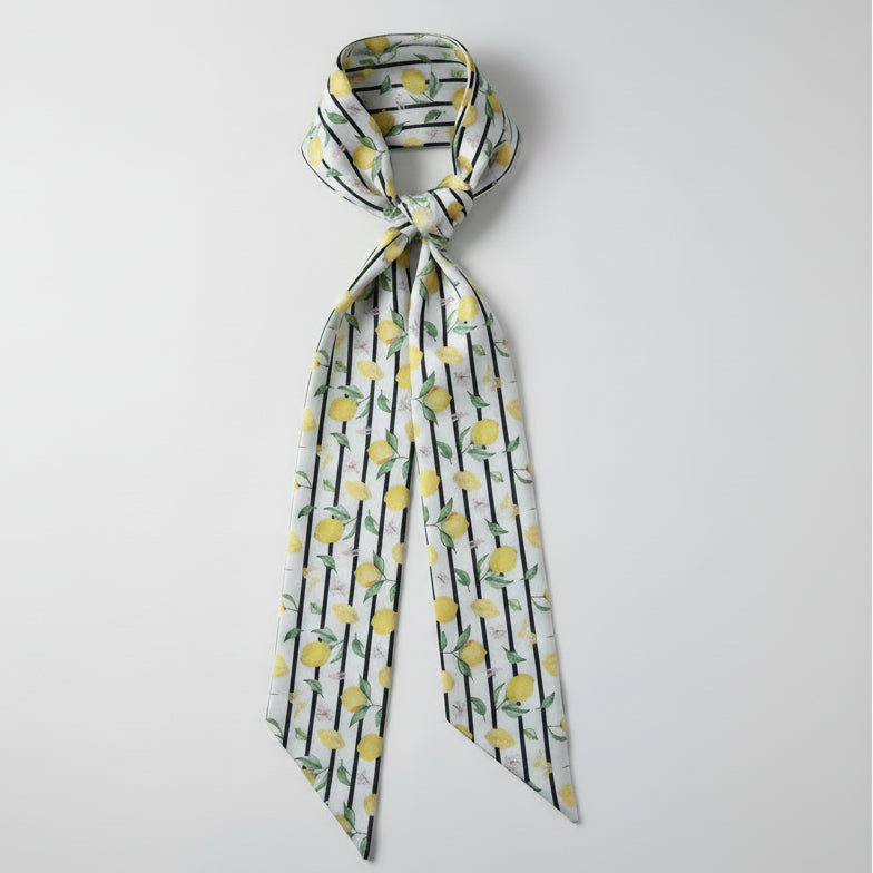 Scarf with lemon pattern and thin black stripes on a white background