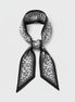 Scarf with black vertical lines with a beige and black leopard print design on a white background