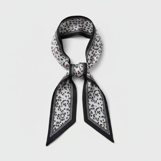 Scarf with black vertical lines with a beige and black leopard print design on a white background